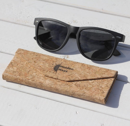Hidden Rayz The Original matte black wayfarer sunglasses with ebony wood arms on their cork case